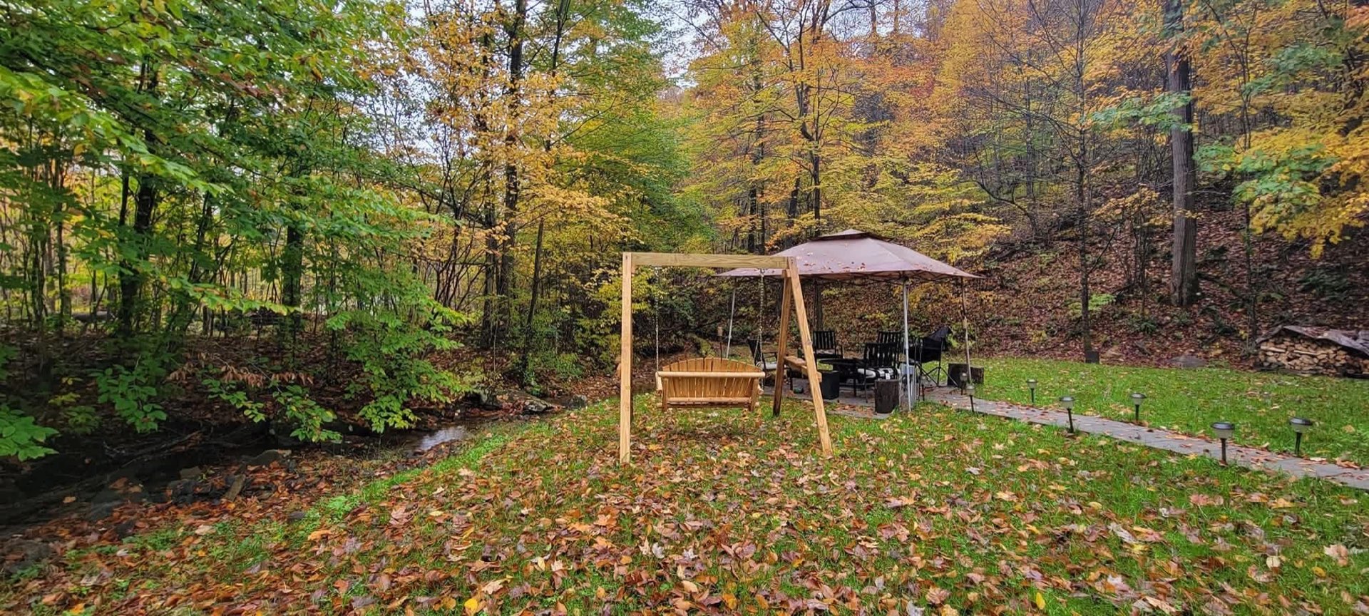 Creekside swing and gazebo in fall color at 1845 Whitewater Parkway