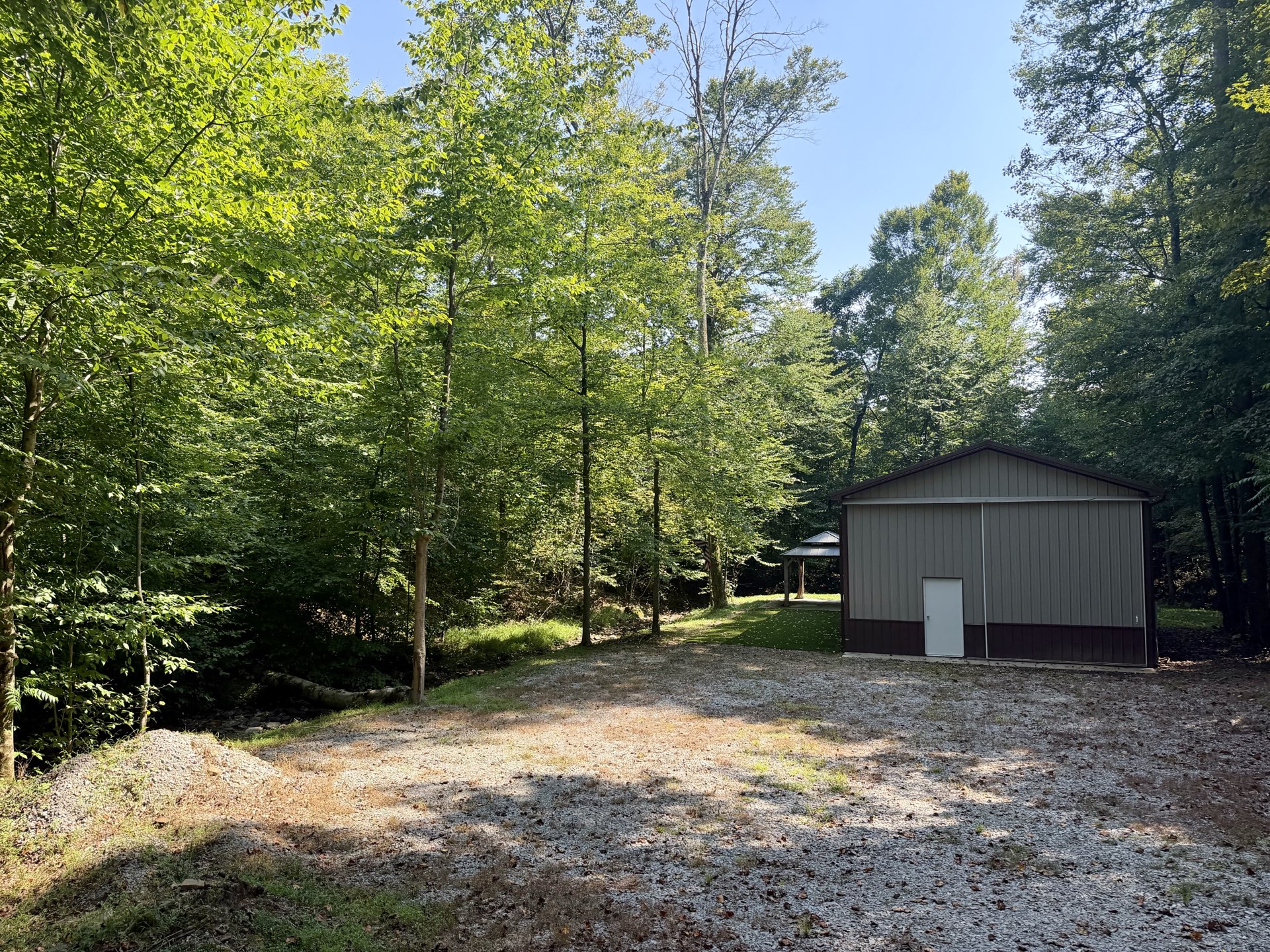 Pole barn and gazebo along the creek at 1845 Whitewater Parkway